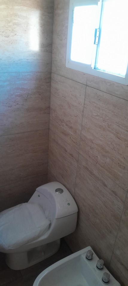 A Estrenar!!  Dpto 2 Ambientes en Zona Comercial.Con Patio, Parrilla, y Cochera - Ideal Turismo-.